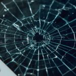 Lucid_Realism_A_closeup_shot_of_a_damaged_tablet_with_a_cracke_0