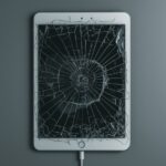 Lucid_Realism_A_worn_and_damaged_iPad_with_a_cracked_screen_di_2